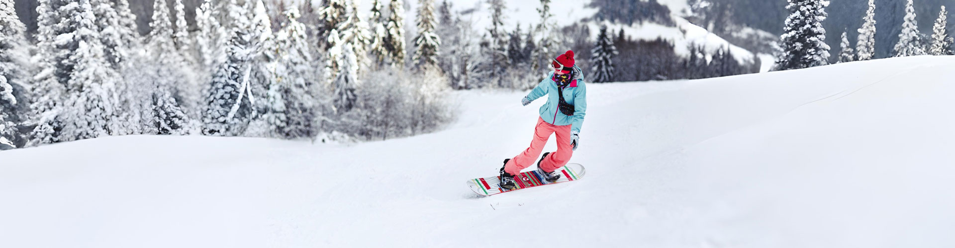 Skier carving through a groomed run near Park City