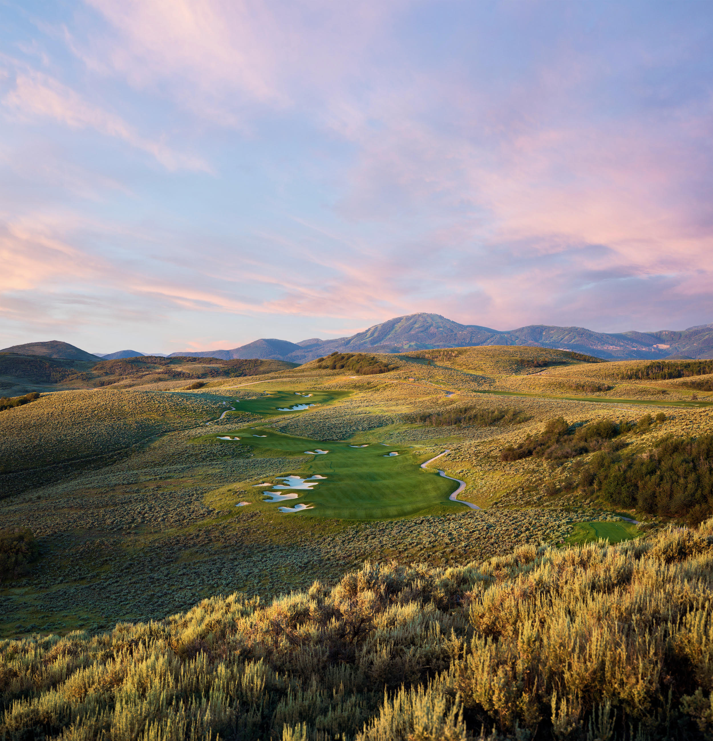 Promontory Club golf course and mountain landscape at golden hour
